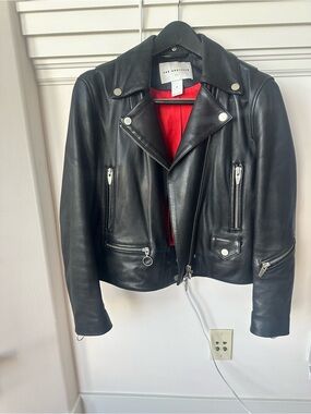 The Arrivals Black Leather Moto Jacket with Red Lining excellent condition.